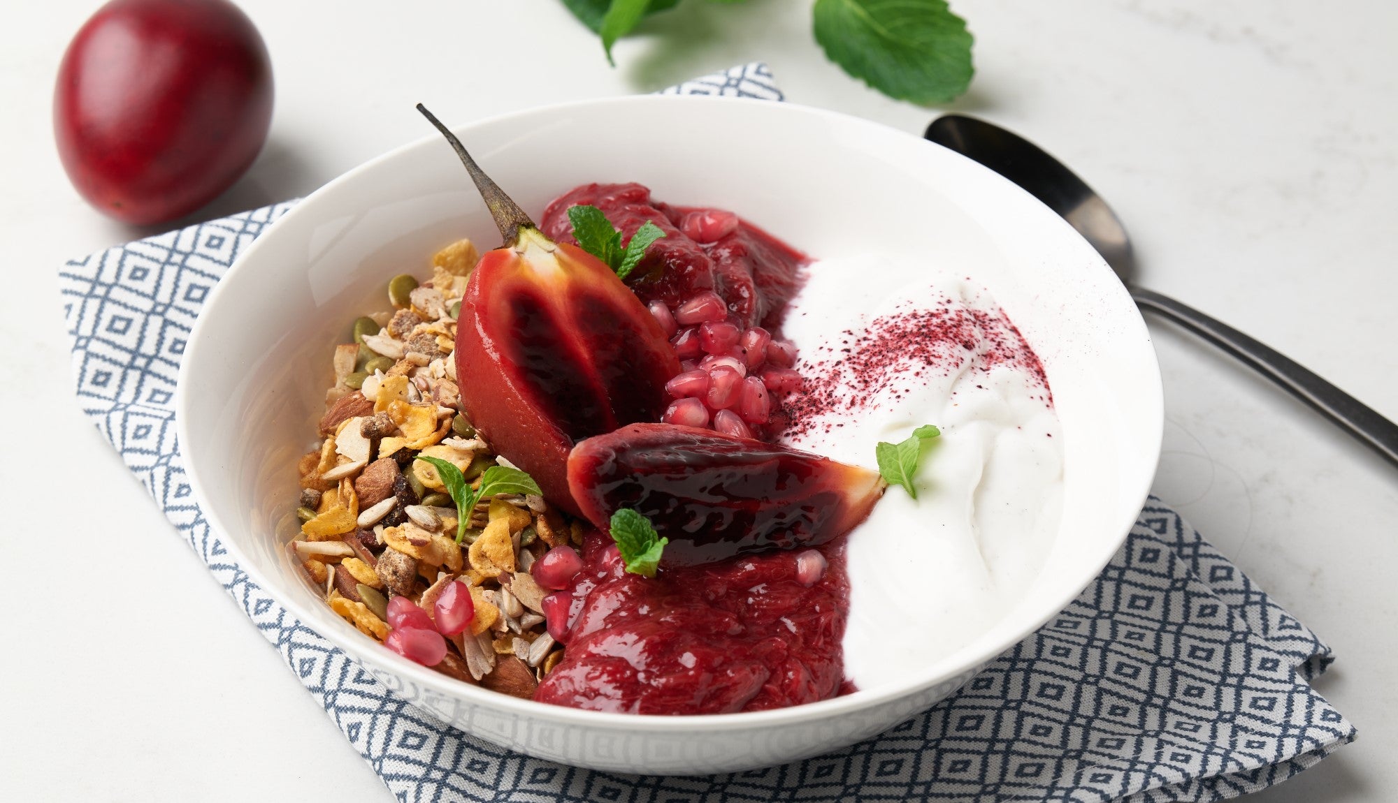 Poached tamarillo granola bowl